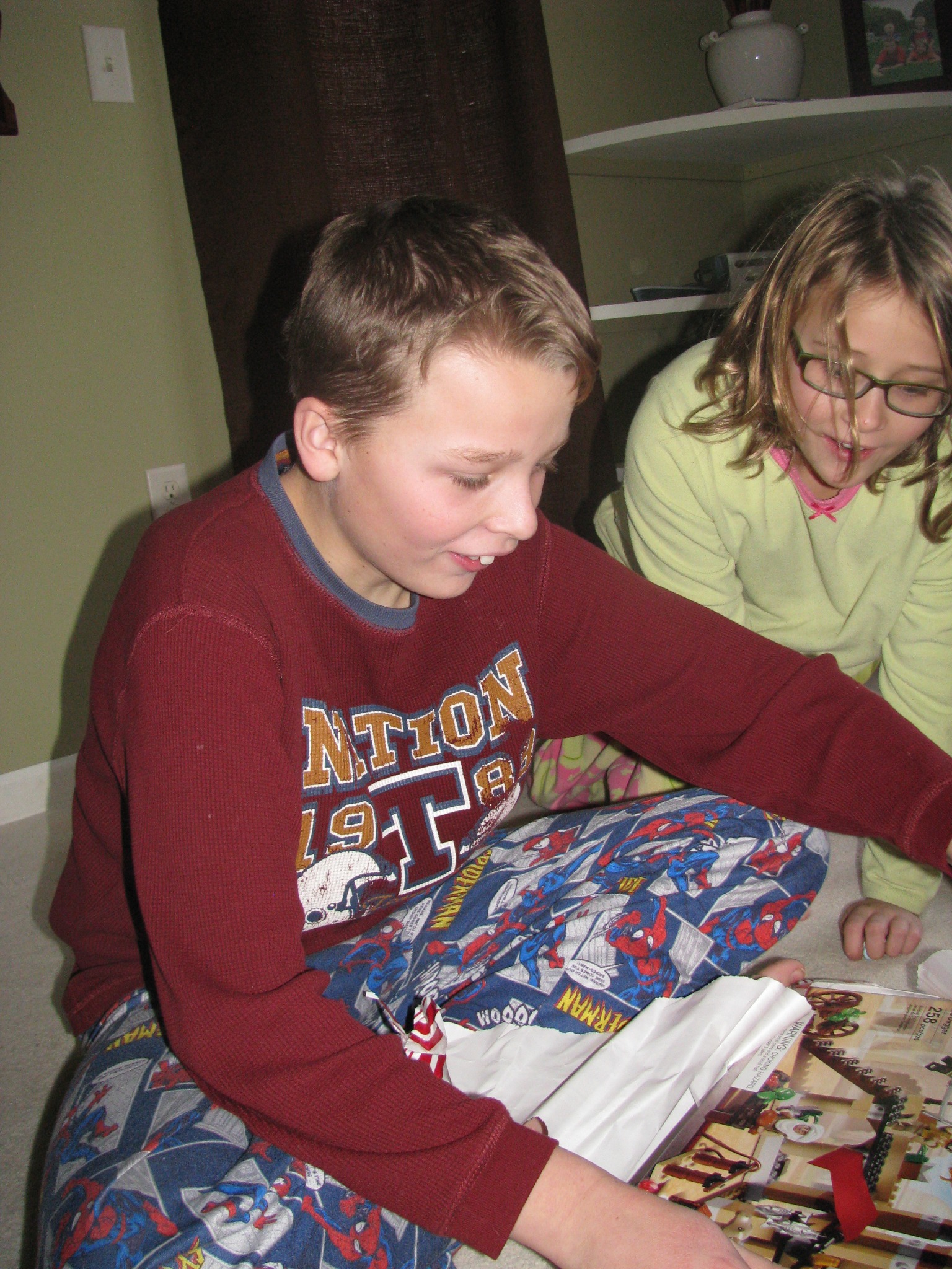 Zach opening a LEGO set as a child