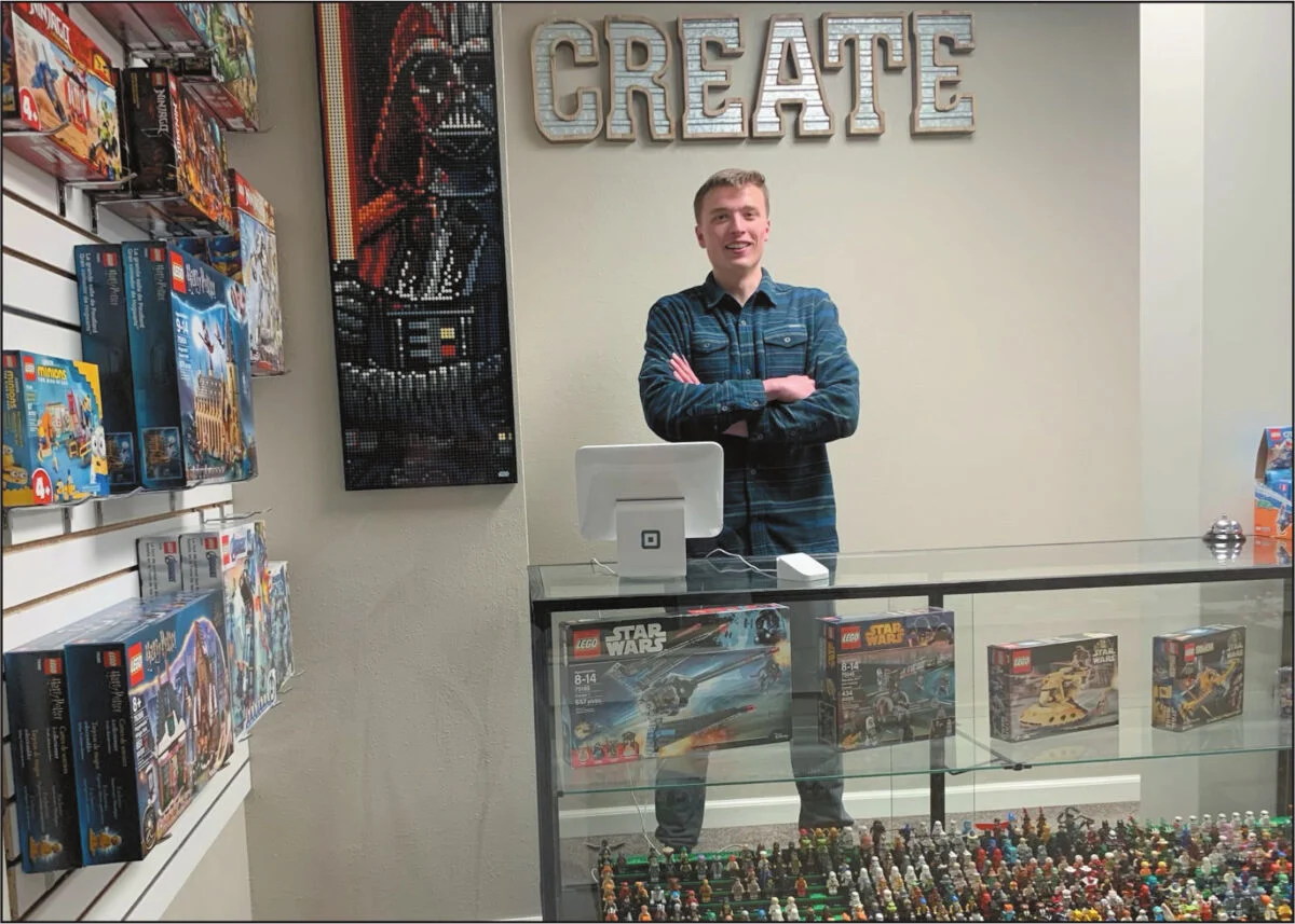 Zach behind the counter at the original 500-square-foot Wapi Bricks store