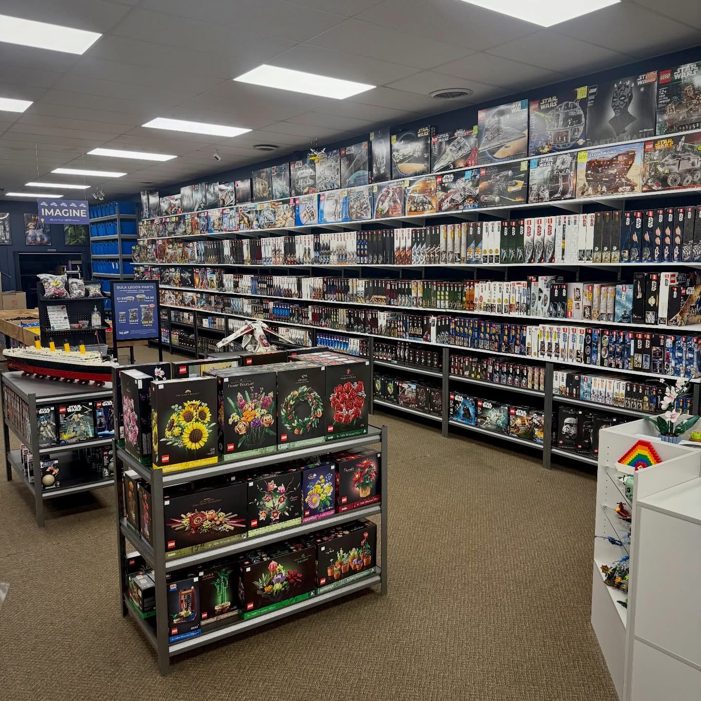 LEGO sets and minifigures displayed throughout Wapi Bricks